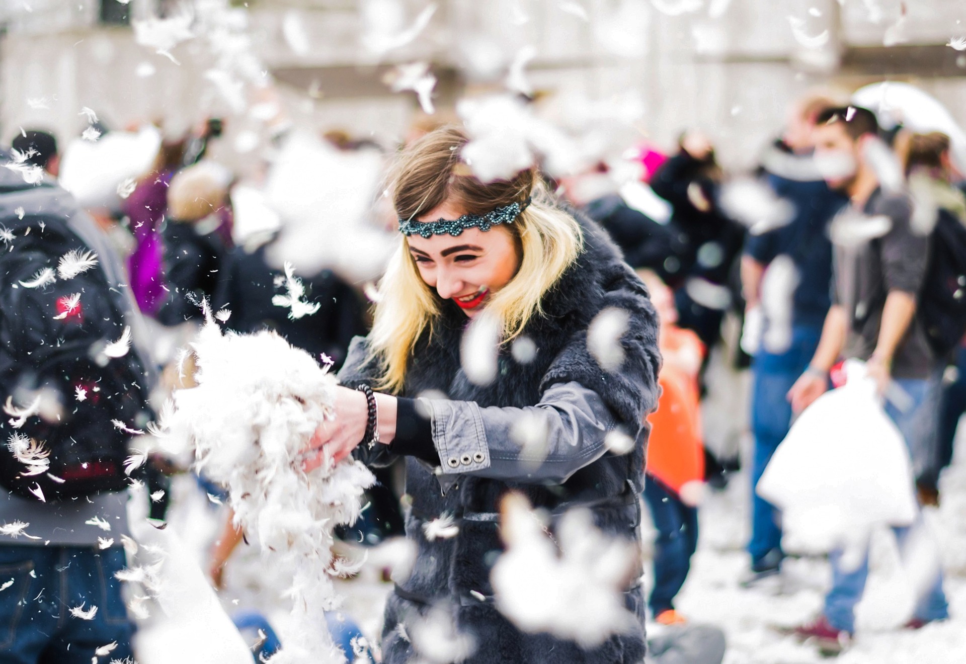 Women playing with feathers